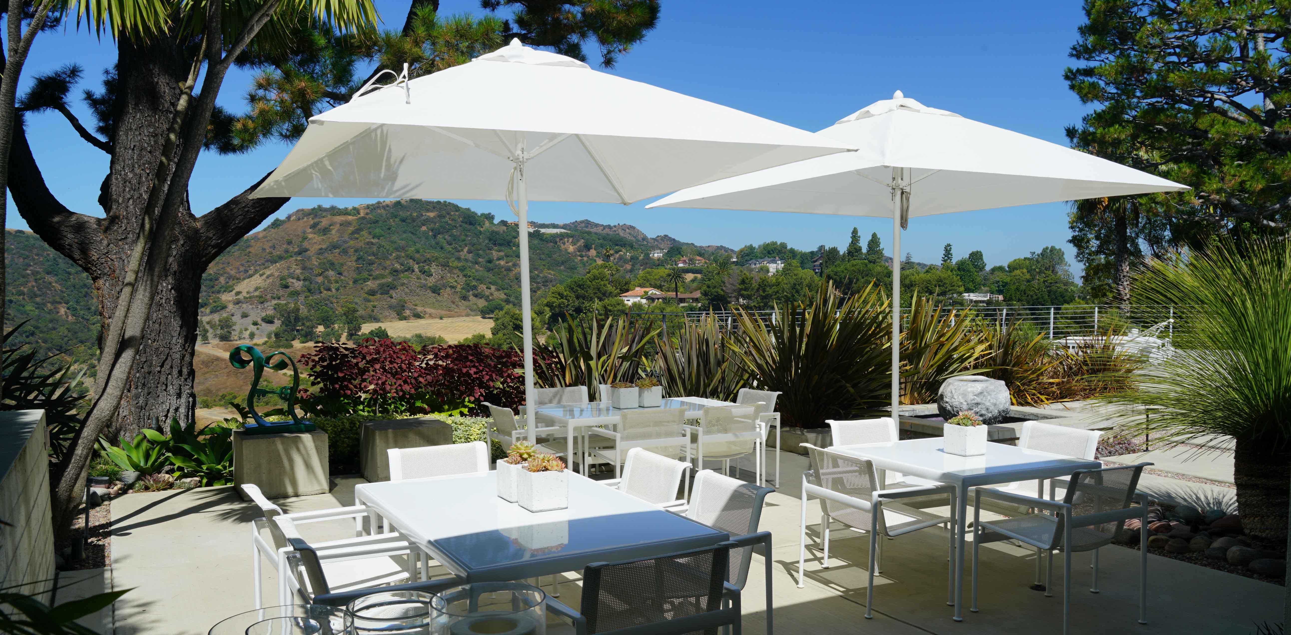 Image of Paseo umbrellas over dining tables
