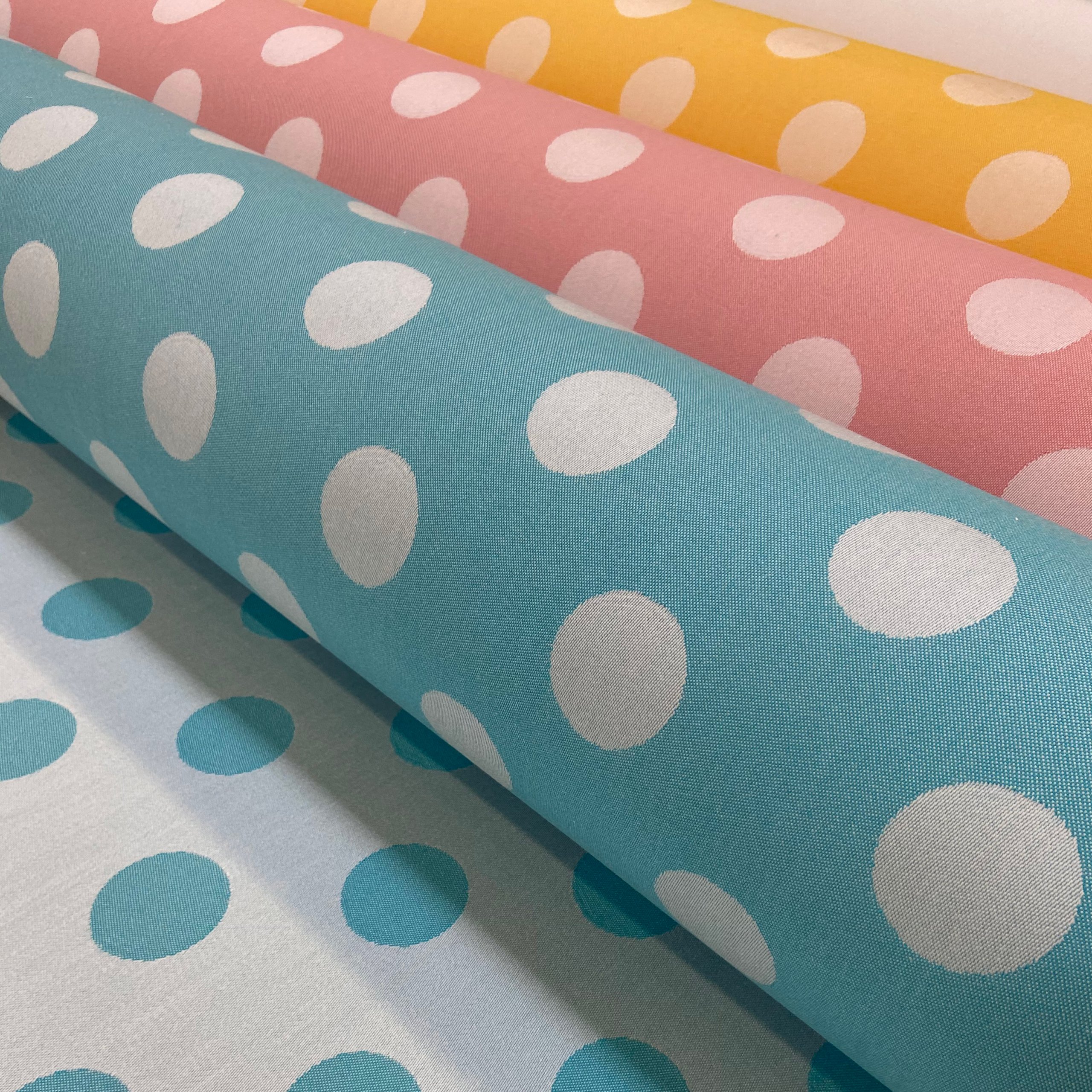 Image of Rolls of Dots Fabric