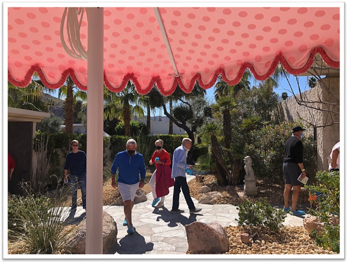 Image of Santa Barbara umbrella and guests at Modernism Week