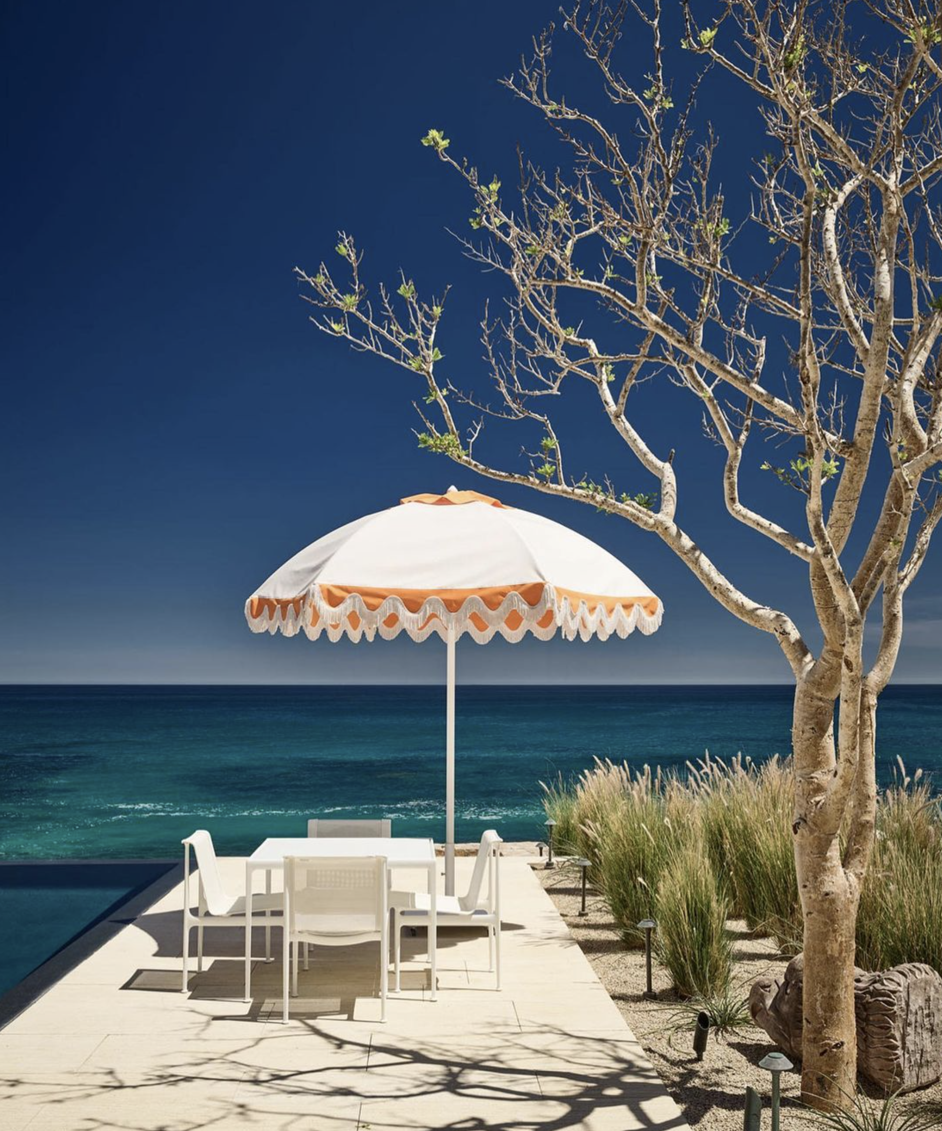 Image of umbrellas poolside