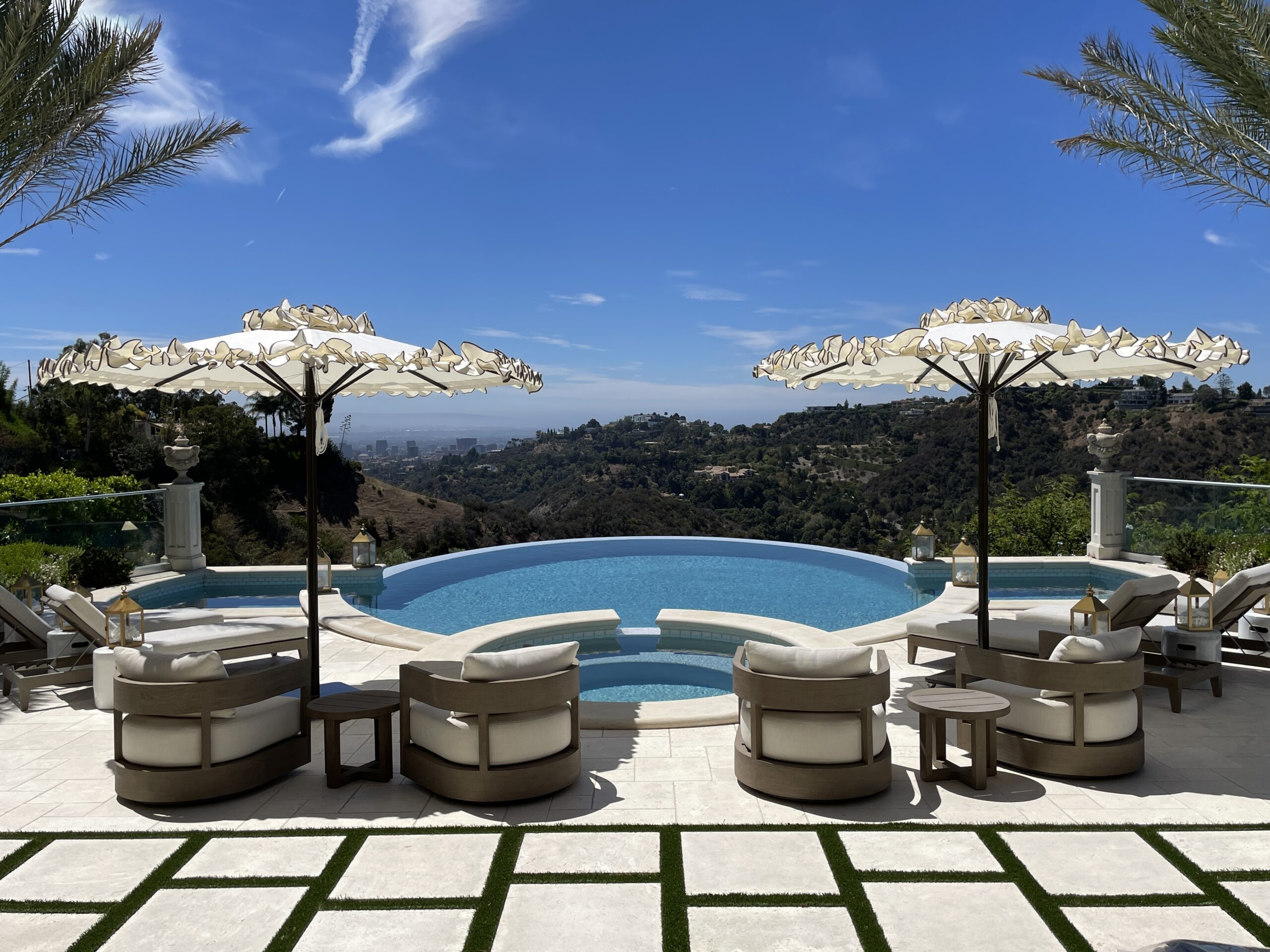 Image of umbrellas and furniture poolside