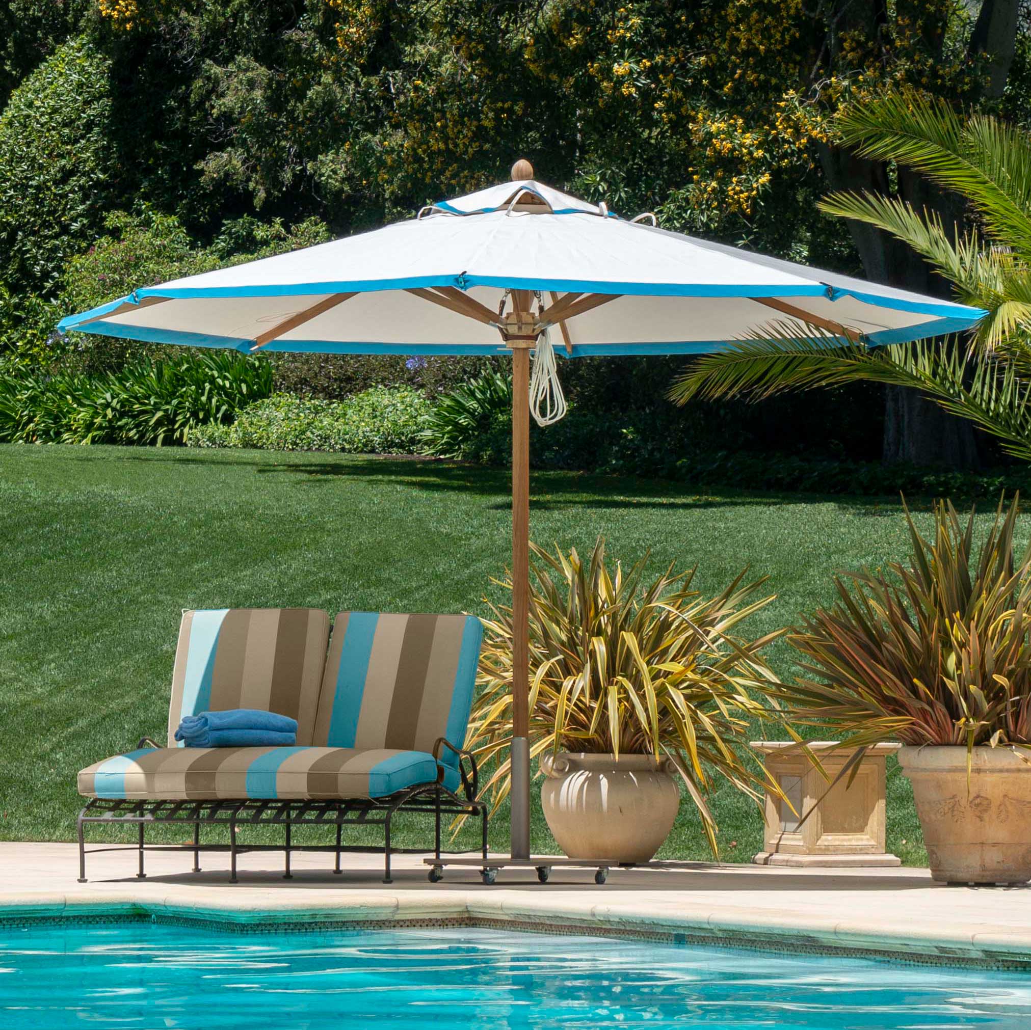Image of umbrella with banding, poolside