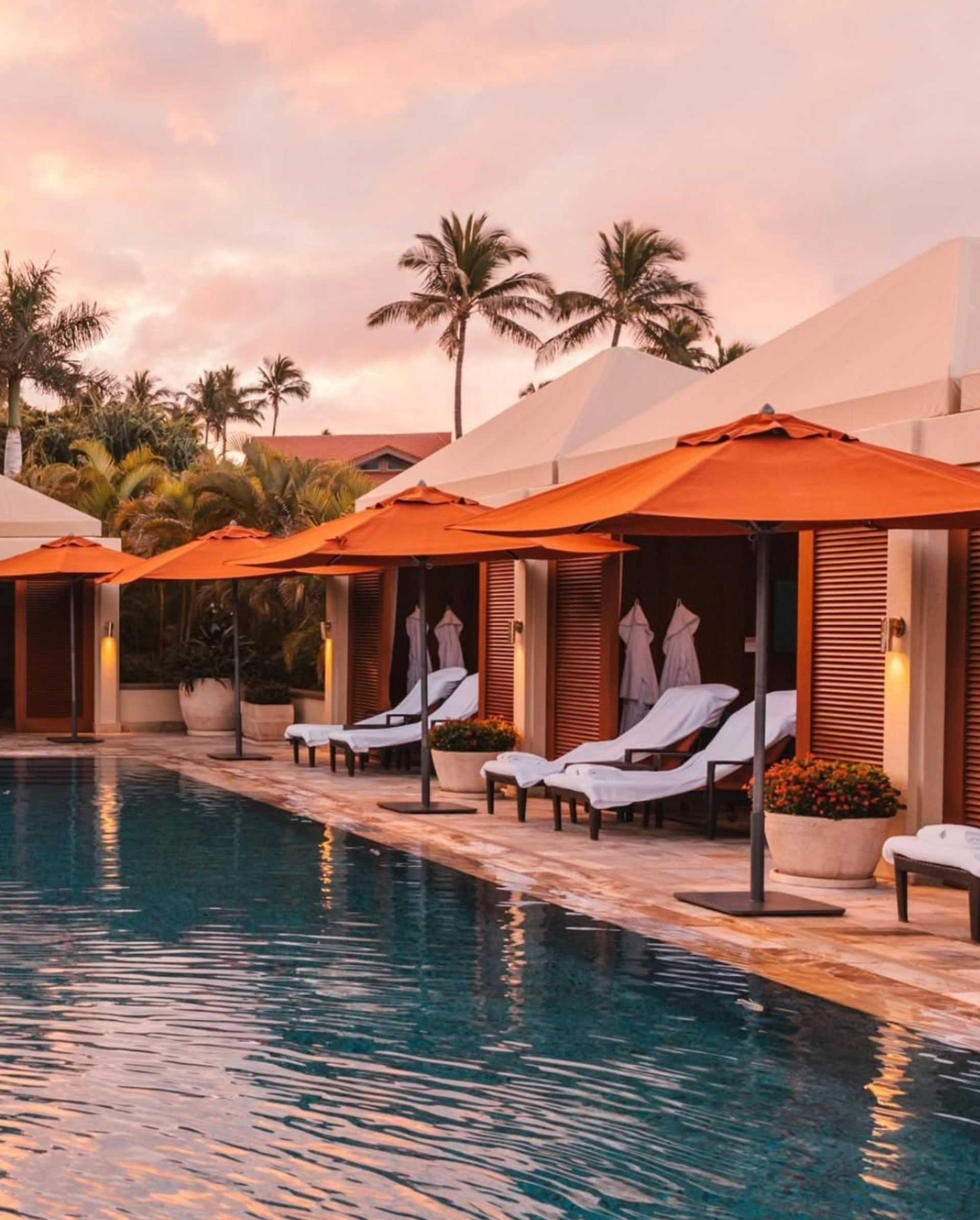 Image of umbrellas and furniture poolside
