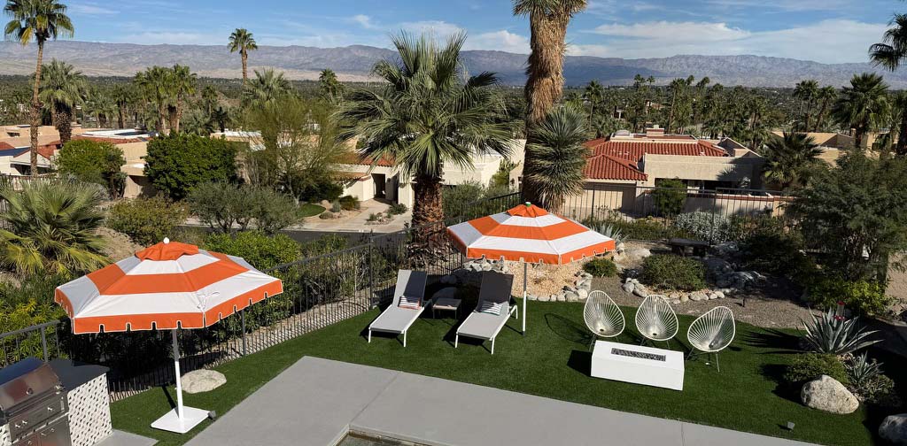 Image of umbrellas and furniture poolside